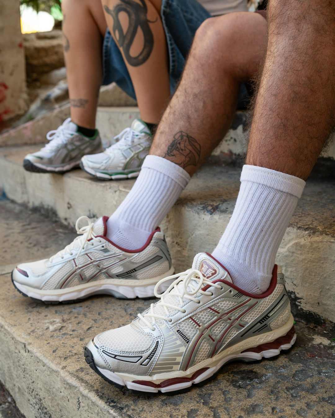 ASICS Gel-Kayano 12.1 on feet on concrete steps. Photo: @sizeofficial via Pinterest