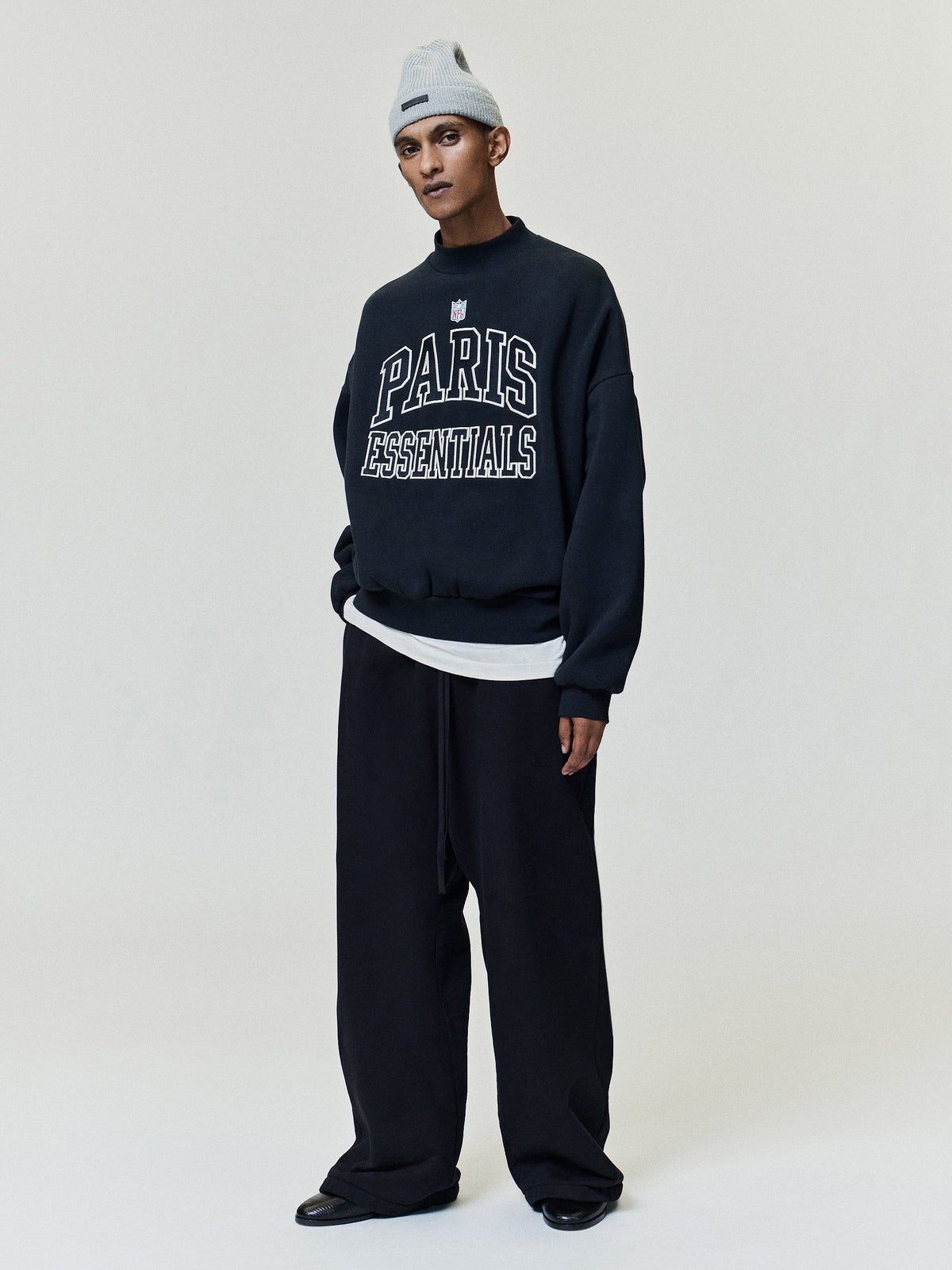 Fear of God Essentials NFL Paris Boxy Crewneck Vintage Black