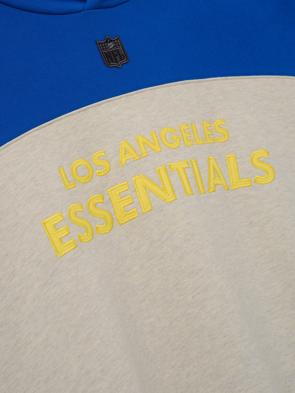 Fear of God Essentials Rams 90s Relaxed Hoodie Vanilla Heather
