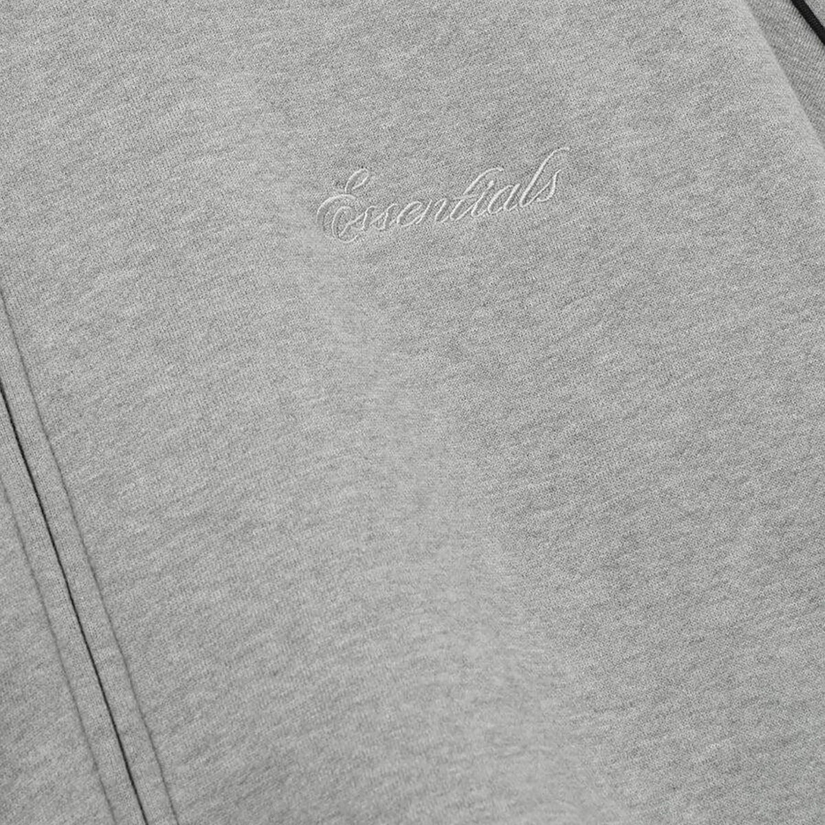 Fear of God Essentials Modern Track Jacket With Piping Concrete Heather/Black (FW25) - Im Your Wardrobe