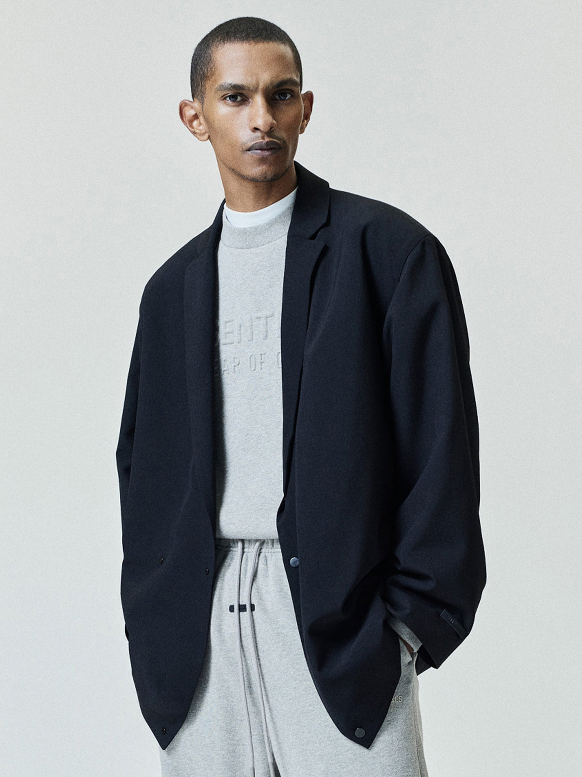 Fear of God Essentials Embossed FW26 90s Relaxed Crewneck Warm Heather - Im Your Wardrobe