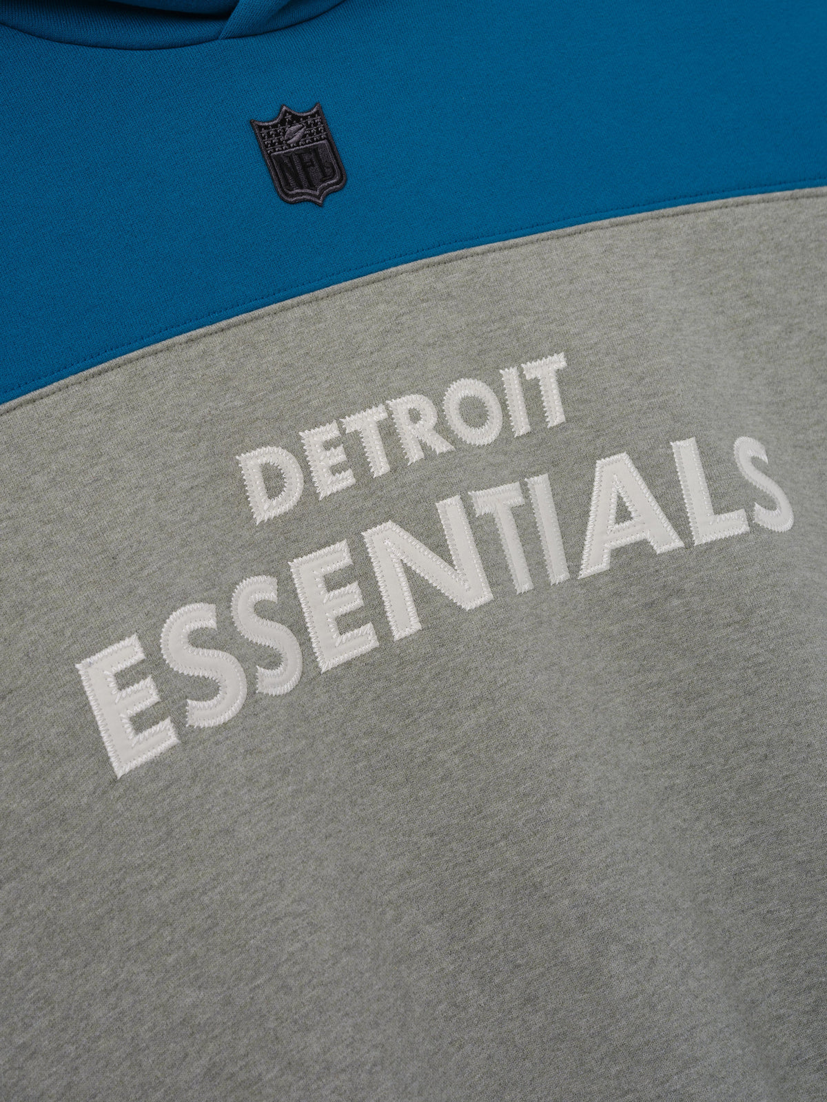 Fear of God Essentials Lions 90s Relaxed Hoodie Concrete Heather