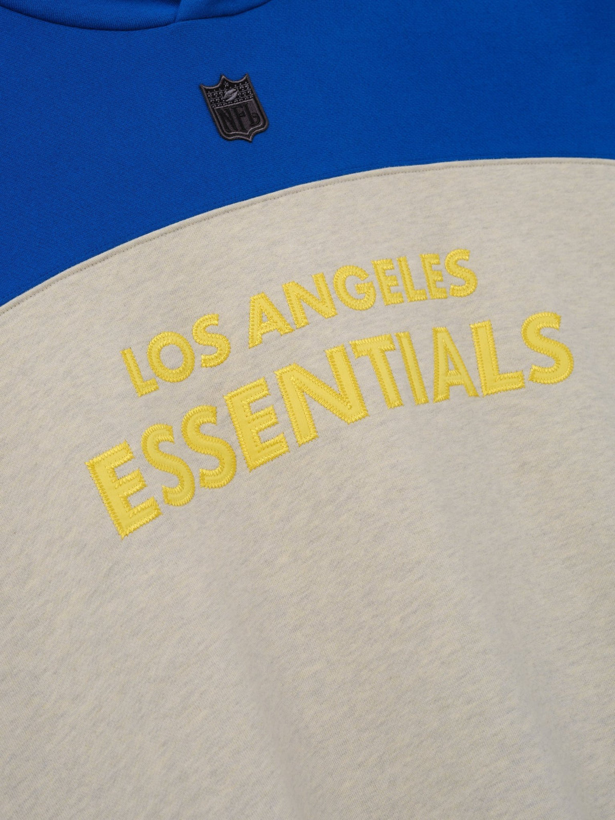 Fear of God Essentials Rams 90s Relaxed Hoodie Vanilla Heather - Im Your Wardrobe